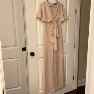 Size medium, color taupe, v-neck romper.